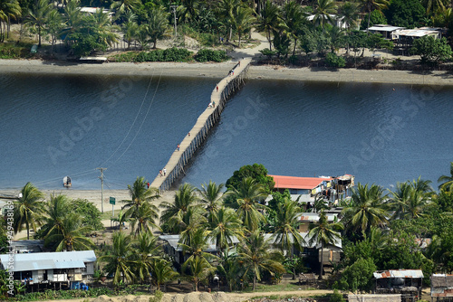 Obraz na plátně The bridge built by PNG-LNG workers to support the village life in Lea Lea, Papua New Guinea aerial image