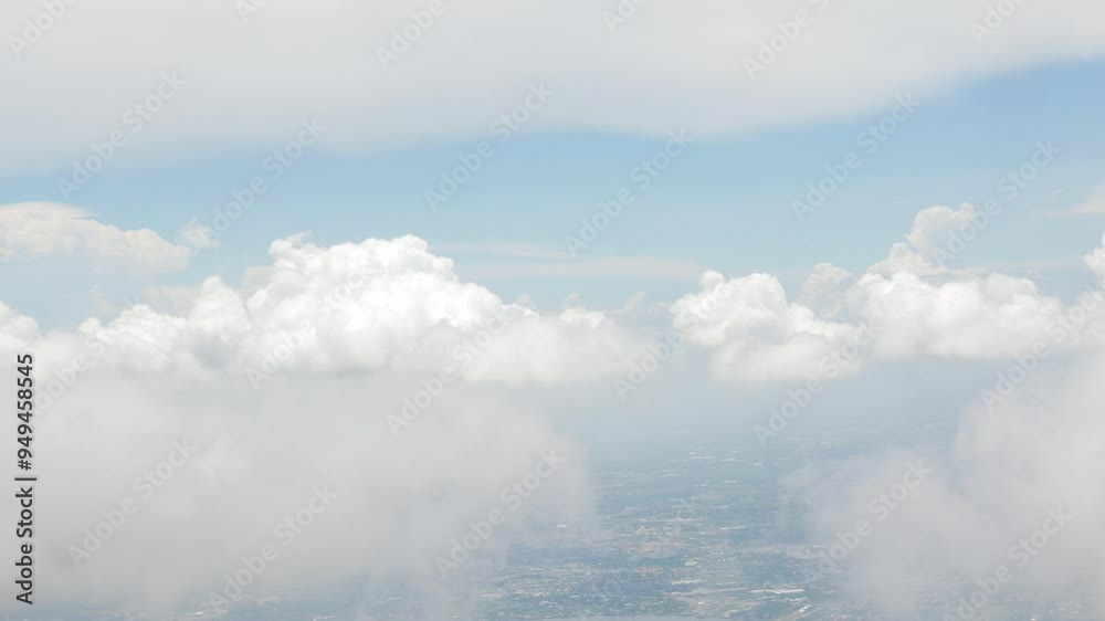 view from plane over blue sky with white Fluffy clouds while flying through in sunny summer time.nature blue sky cloud and sun for Clean Environment, save energy or transportation holiday concept. view from plane over blue sky with white Fluffy clouds while flying through in sunny summer time.nature blue sky cloud and sun for Clean Environment, save energy or transportation holiday concept.