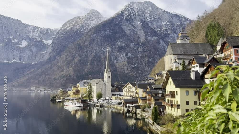 Hallstatt on a quiet early Spring morning, with beautiful reflections on the water and no tourists Hallstatt on a quiet early Spring morning, with beautiful reflections on the water and no tourists