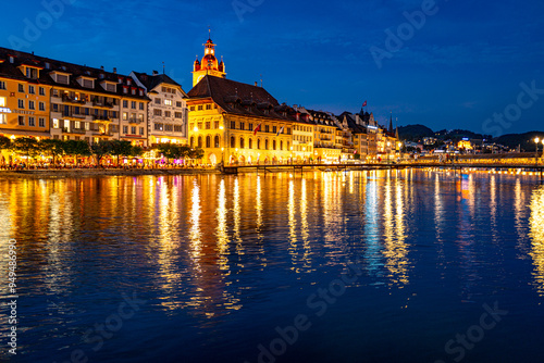 Lucern city with famous Chapel Bridge. Riverfront in Lucerne, Swiss. Lucerne city view. Canton of Lucerne. Lucern Switzerland. Sunrise in historic city center of Lucerne with lake.