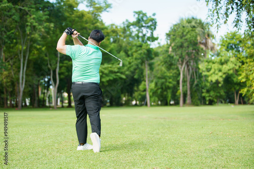 Man is playing golf in morning.