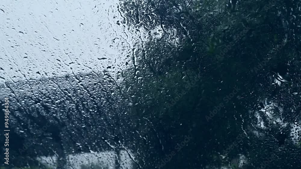 Dew drop on the car glass window during raining. Dew is the moisture that forms as a result of condensation.
