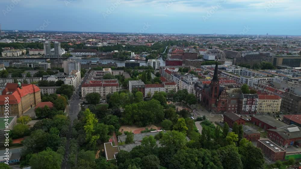 Emanuel lasker school sports field soccer field berlin's cityscape with the spree river on a sunny summer day. Majestic aerial view flight rotation to right drone Emanuel lasker school sports field soccer field berlin's cityscape with the spree river on a sunny summer day. Majestic aerial view flight rotation to right drone