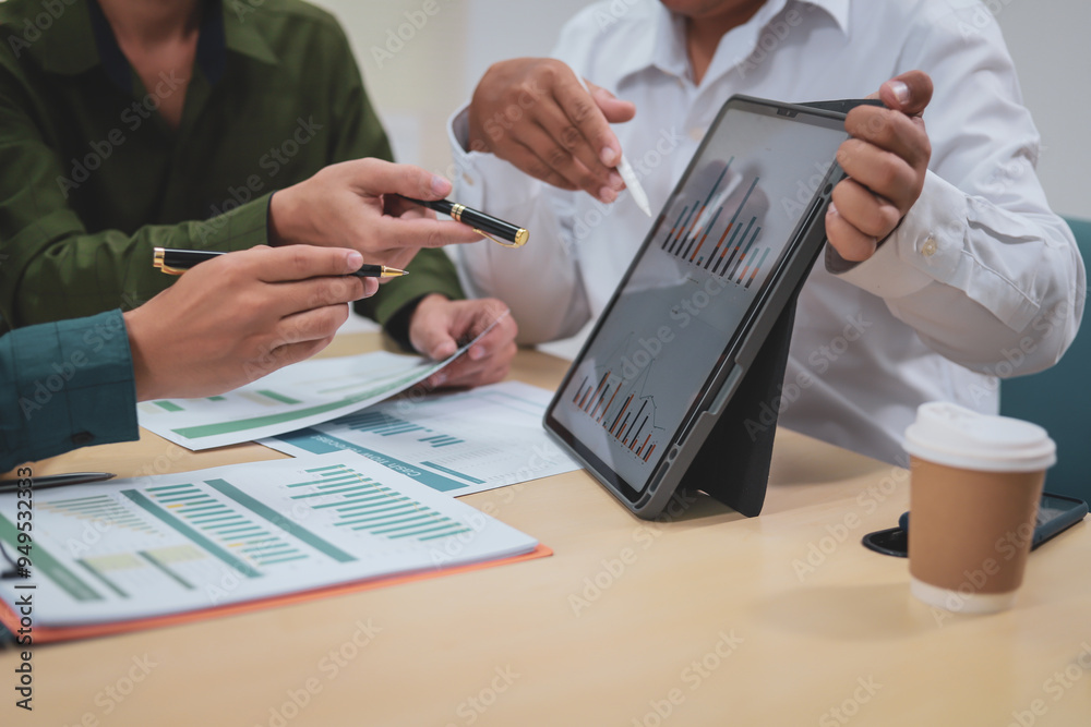 Fototapeta premium A businessman,embodying strategic leadership, sits at his desk in a modern office, planning and managing departments systematically to ensure organizational success through effective administration