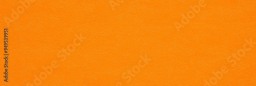 a seamless texture of slightly textured colored paper in honey orange color