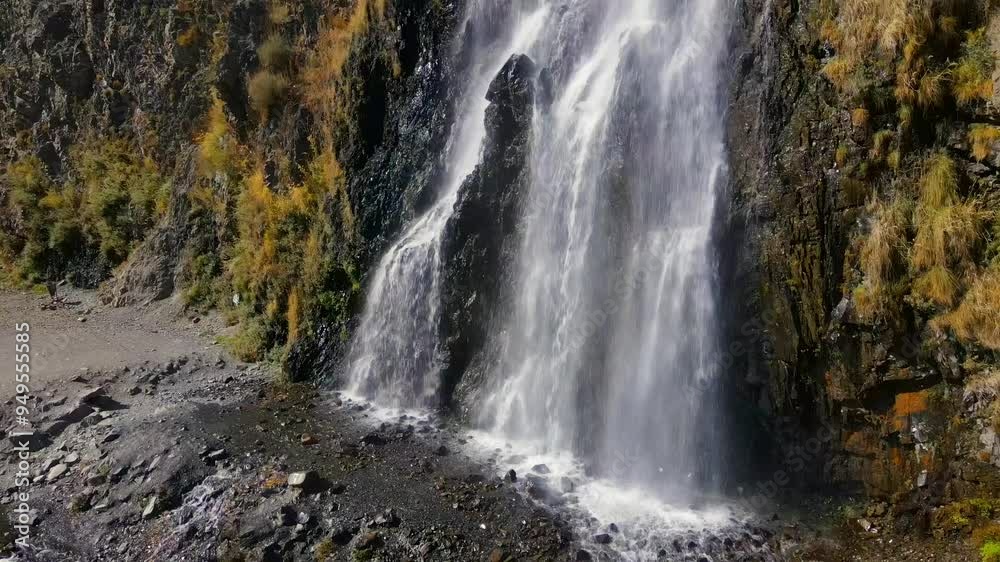 Aerial view of the majestic Manthokha Waterfall cascading through the rugged Kharmang Valley, Skardu, Pakistan. Aerial view of the majestic Manthokha Waterfall cascading through the rugged Kharmang Valley, Skardu, Pakistan.