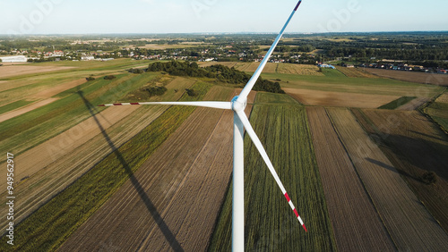 Wind turbines in rural sunset landscape photo