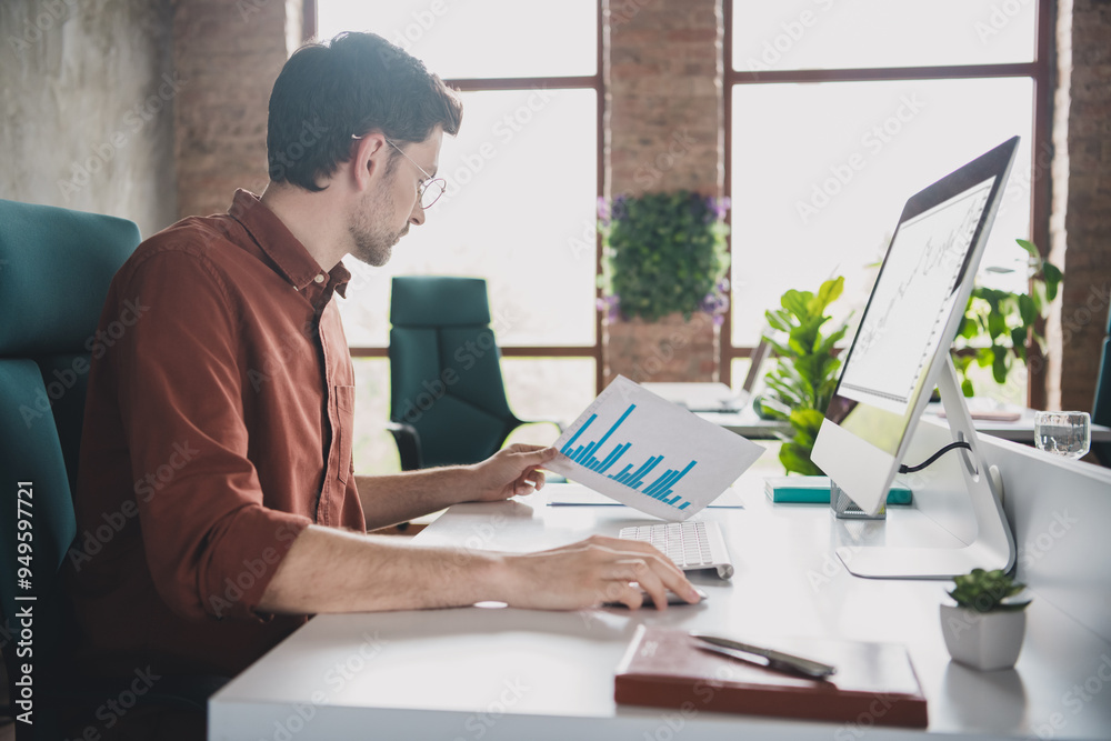 Photo of handsome man watch graph trader sit tables coworking successful businessman wear brown formalwear nice creative light office Photo of handsome man watch graph trader sit tables coworking successful businessman wear brown formalwear nice creative light office