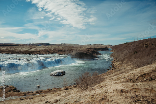 Faxafoss waterfall, Iceland in spring under blue sky. photo