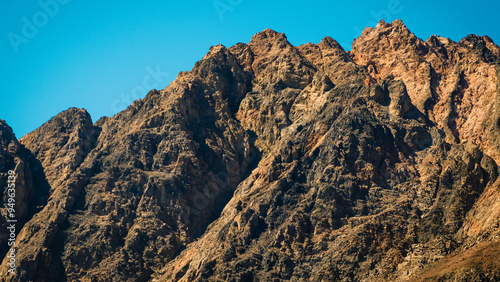 peaks of high rocky mountains against a blue sky in Egypt