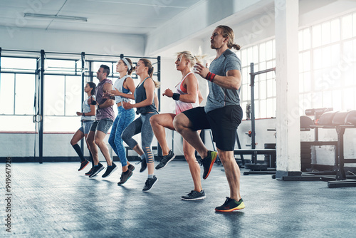 Fitness, people and exercise with warm up for leg training, wellness and body workout. Team, cardio and personal trainer challenge with active routine for health group at class in gym center