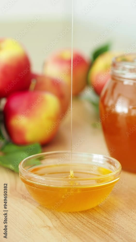 To demonstrate the naturalness and quality of natural honey. Honey drips from a spoon into a bowl. Liquid flower honey of a fresh harvest. Beekeeper's small business To demonstrate the naturalness and quality of natural honey. Honey drips from a spoon into a bowl. Liquid flower honey of a fresh harvest. Beekeeper's small business