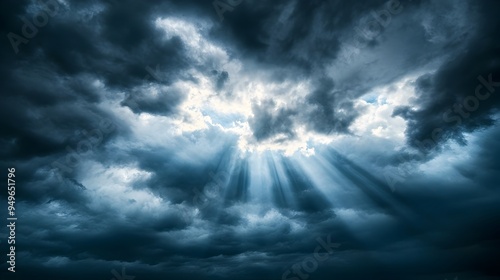 Dramatic Stormy Skies with Ethereal Sunlight Bursting Through Dark Clouds photo