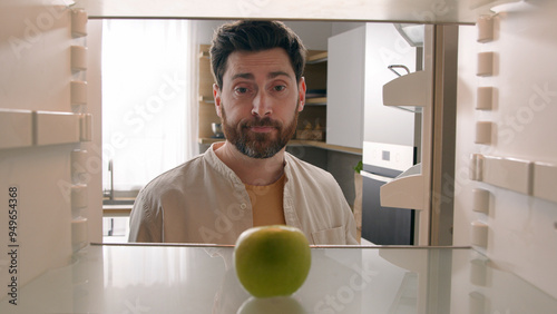 Photography POV point of view from inside refrigerator Caucasian adult man at kitchen open e