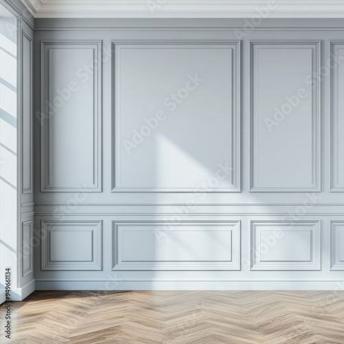 Minimalist interior with a light gray paneled wall, herringbone parquet flooring, and natural light casting gentle shadows, creating a peaceful and refined ambiance