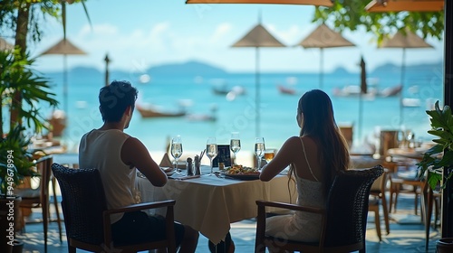 couple having lunch at a restaurant looking out over the ocean of Pattaya Thailand man and woman having dinner in a restaurant by the ocean in Pattaya : Generative AI photo