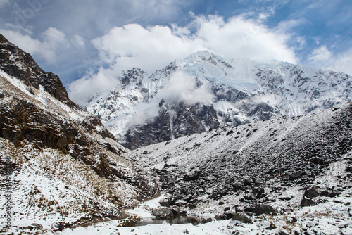 Clouds rolling over mountain on Salkantay trek in Peru photo