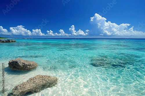 Clear Blue Water and Rocks on a Tropical Beach