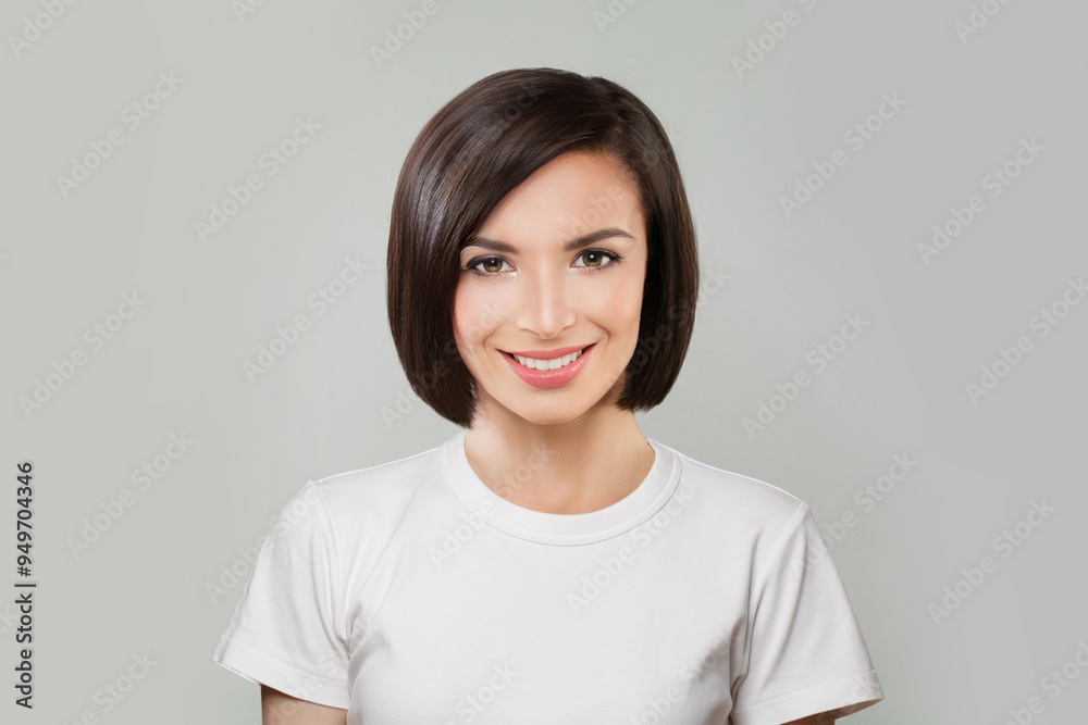 Fashion portrait of happy young female model with natural make-up, shiny clean skin and perfect short bob hair. Beautiful woman face Fashion portrait of happy young female model with natural make-up, shiny clean skin and perfect short bob hair. Beautiful woman face