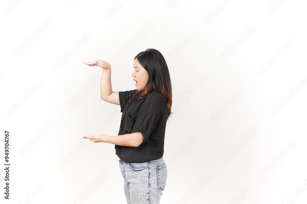Young Asian woman Measuring and Showing Big Product wearing Black t-shirt and jeans isolated on white background Young Asian woman Measuring and Showing Big Product wearing Black t-shirt and jeans isolated on white background