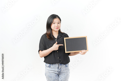 Young Asian woman Showing and holding black or chalk board wearing Black t-shirt and jeans isolated on white background