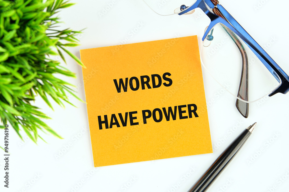 WORDS HAVE POWER TEXT written on a sticker on a white background, top view