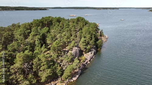 Deserted rocky island covered with forest off the coast of Sweden