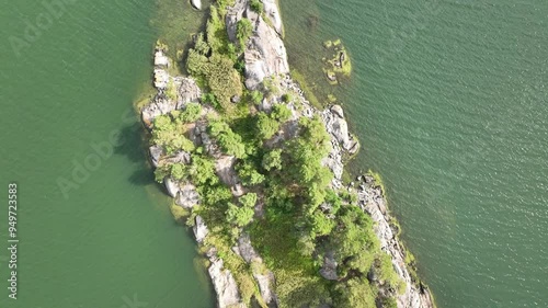 Top view of a deserted island with rocks and forest in Sweden during summer