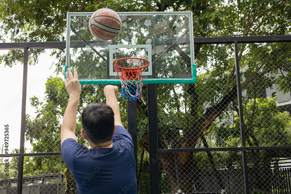 Man Stretching on Basketball Court Outdoors Man Stretching on Basketball Court Outdoors