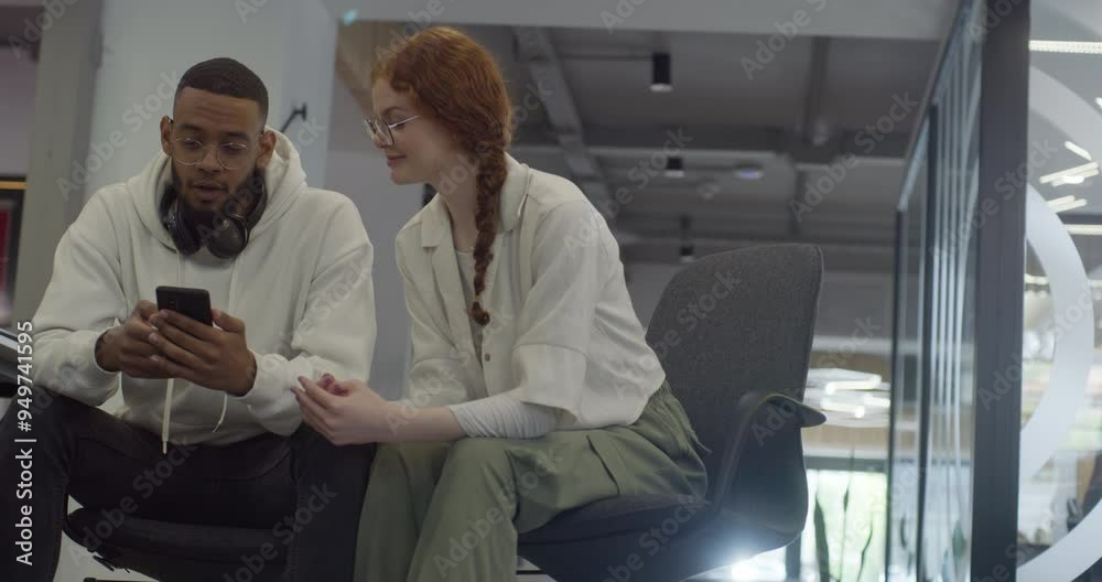 A woman with vibrant orange hair and an African-American business man work together in a modern office, collaboratively solving various business challenges, illustrating diversity, innovation, and A woman with vibrant orange hair and an African-American business man work together in a modern office, collaboratively solving various business challenges, illustrating diversity, innovation, and