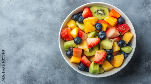 A LOT OF FRUİTS İN BOWL ON GREY BACKGROUND