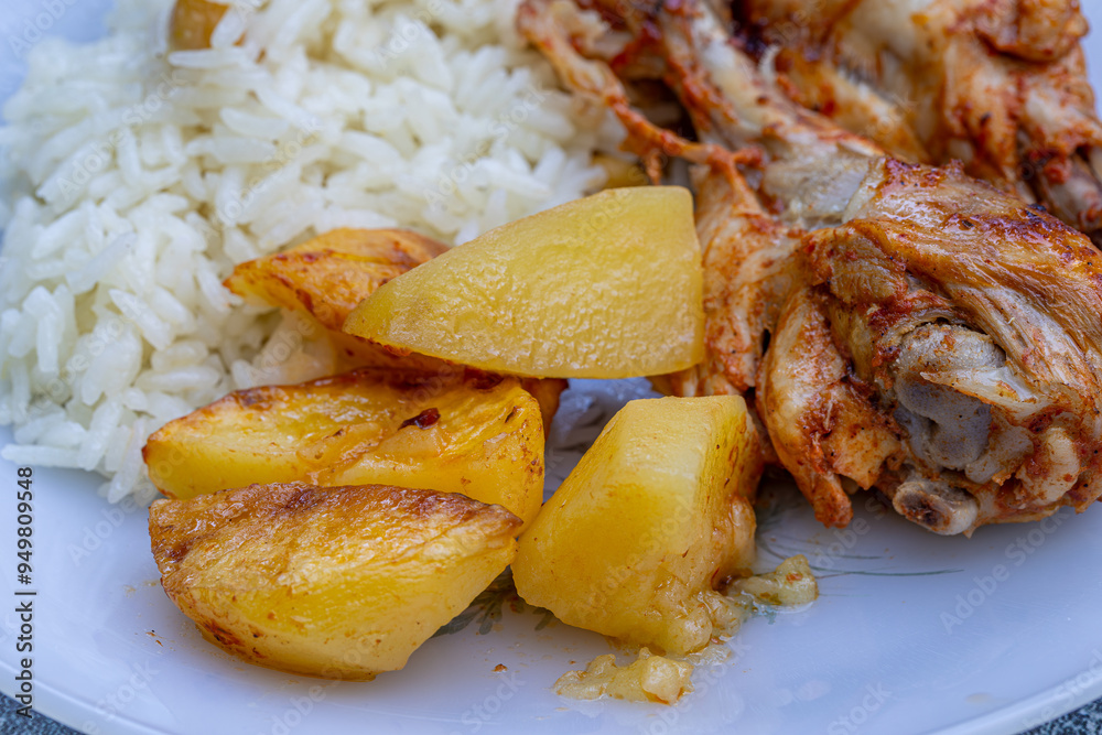 oven-fried chicken legs, french fries and rice pilaf.