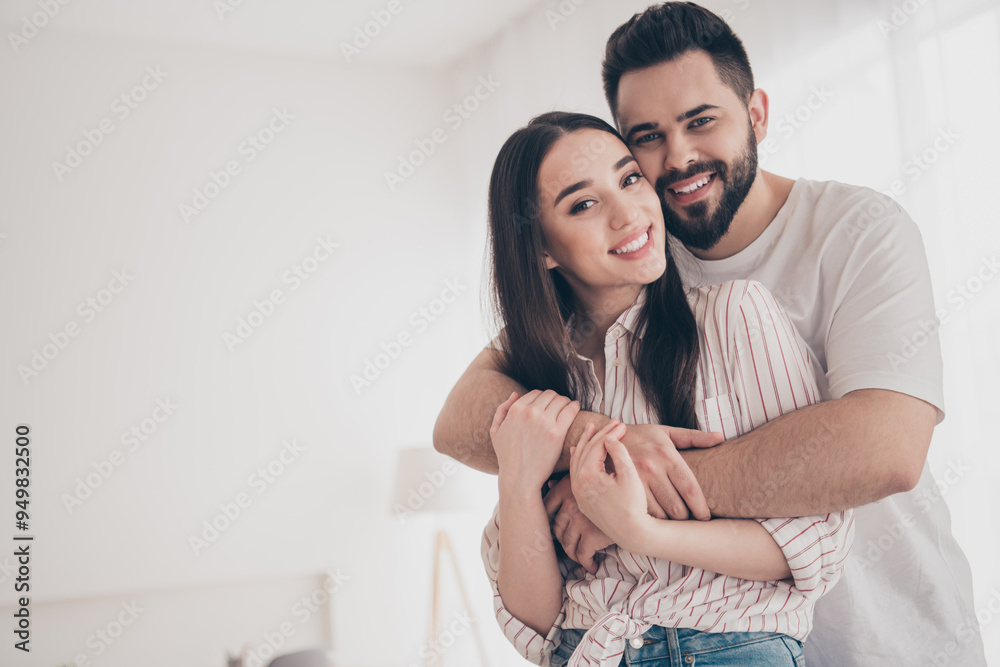 Photo of cheerful cute young couple enjoy weekend couple wife husband hugging buy new apartment indoors inside house home Photo of cheerful cute young couple enjoy weekend couple wife husband hugging buy new apartment indoors inside house home