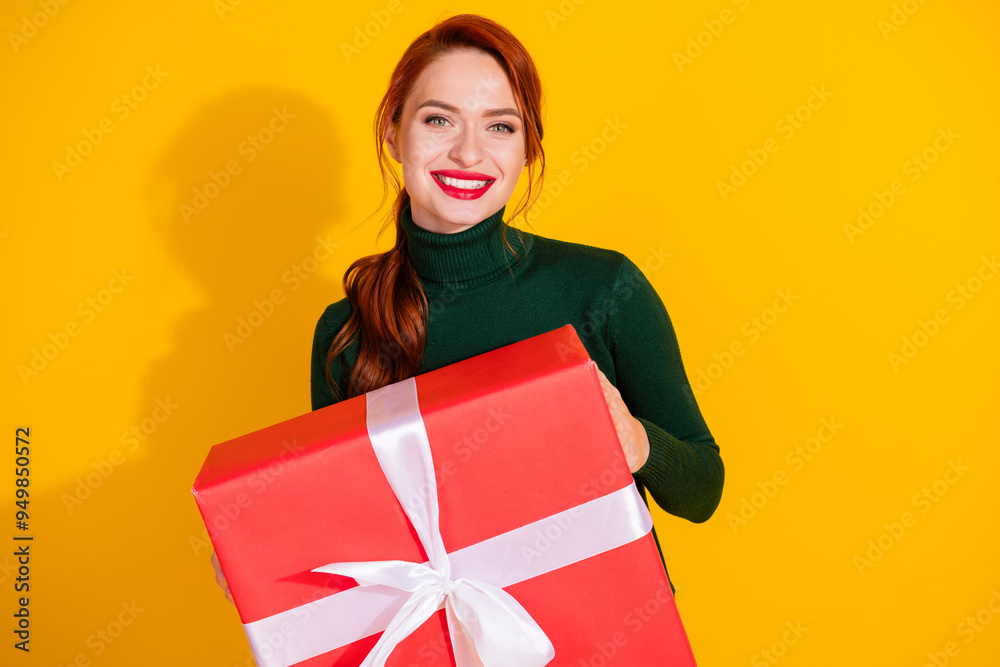 Photo of cheerful pretty lady dressed green jumper getting gift box empty space isolated yellow color background Photo of cheerful pretty lady dressed green jumper getting gift box empty space isolated yellow color background