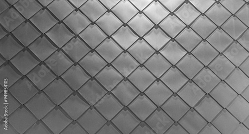 grey Wall texture of metal gray plates. Square rhomb  tin on the wall. The walls are covered with silver sheet metal. Wall and roof protection.