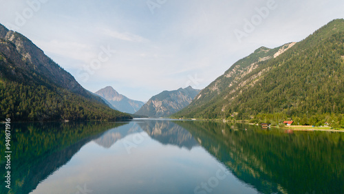 A tranquil morning at Plansee in Austria surrounded by majestic mountains and calm waters