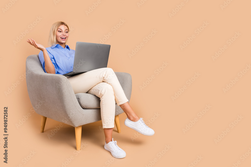 Full length photo of impressed attractive lady dressed formal shirt texting modern gadget empty space isolated beige color background Full length photo of impressed attractive lady dressed formal shirt texting modern gadget empty space isolated beige color background
