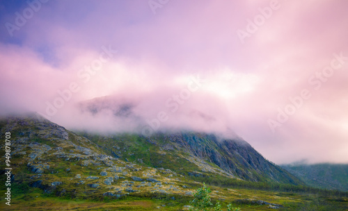 Beautiful mountain in the clouds. Nature of Norway. Lofoten islands