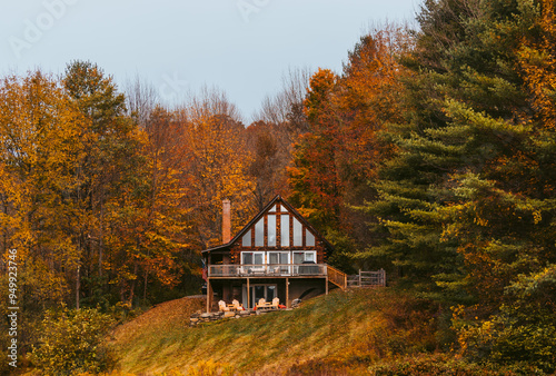 Cabin in the Woods Cloudy Day in Autumn in New England. Fall Foliage Colorful Trees.