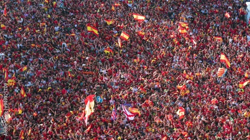 Thousands of fans wave Spanish flags at Cibeles Square, rejoicing in Spain’s 4th UEFA Euro title win over England with their national football team.