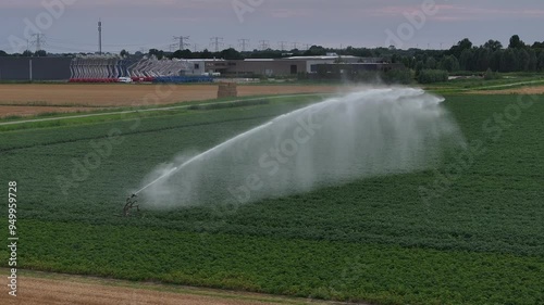 Irrigation Shot, automatic water system technology in planted green fields aerial drone agricultural farm photo