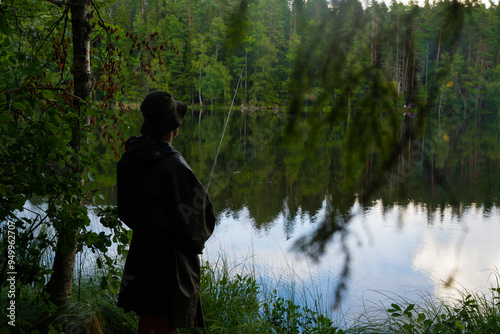 Lonely man fishing in the forest