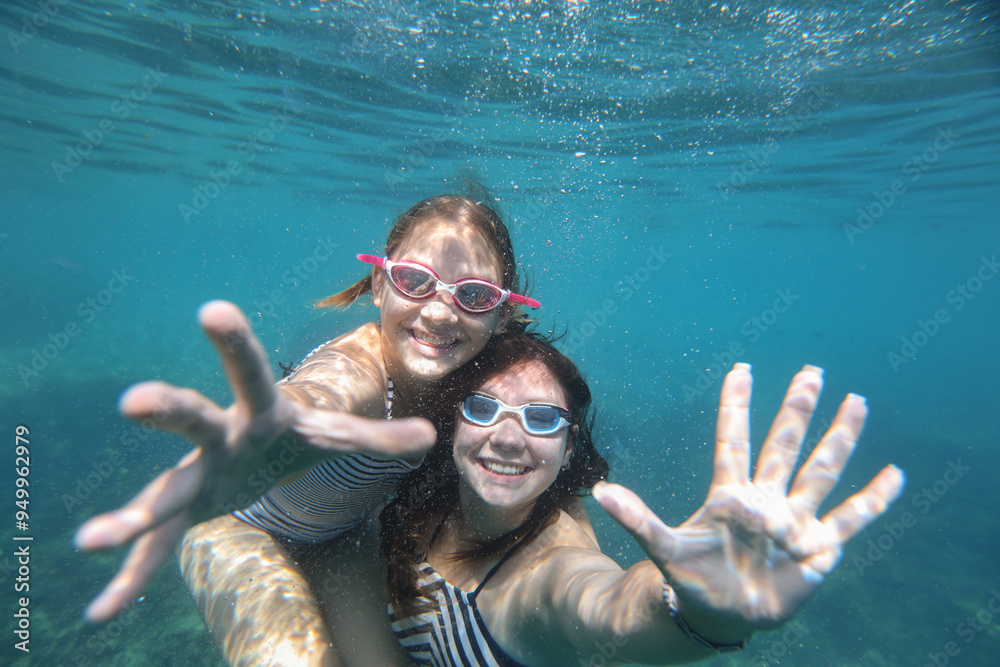 teens girls swimming in sea