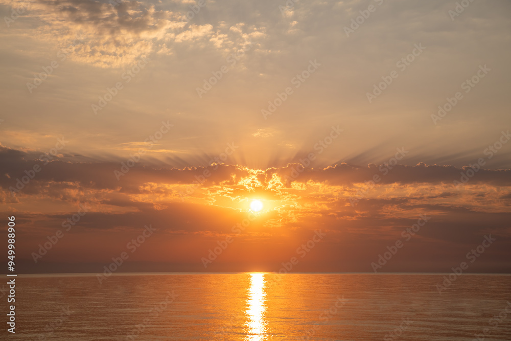 Beautiful sunset or sunrise on the sea, sky with clouds, natural delicate background Beautiful sunset or sunrise on the sea, sky with clouds, natural delicate background