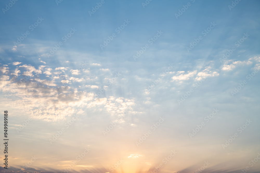 Obraz premium Beautiful sunset or sunrise, sky with clouds, sun rays breaking through the clouds, magical, fabulous natural background, serenity and calm