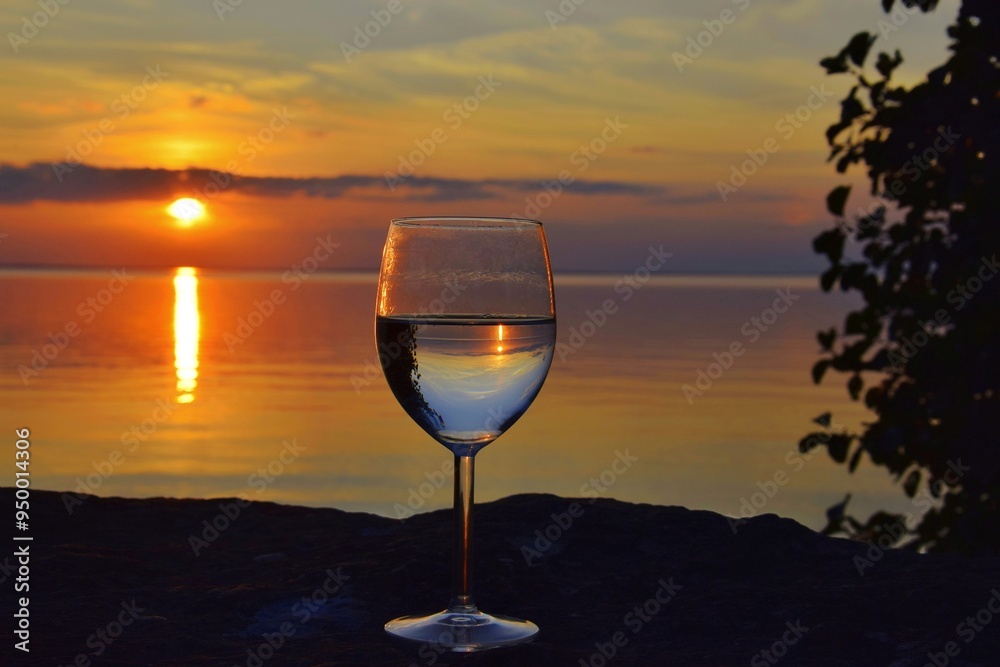 Glass of white wine at sunset. Glass of white wine at sunset.