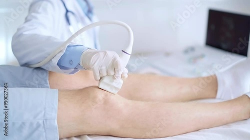 Doctor woman wearing blue medical gloves performing knee ultrasound exam on male patient. Medicine, orthopedic service concept photo