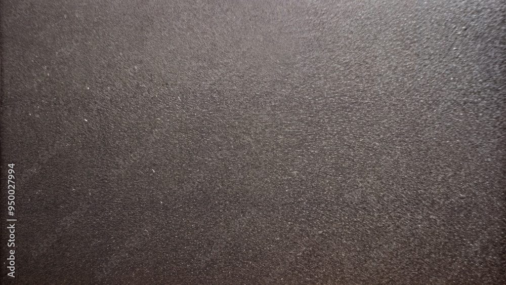 Sandpaper texture in dark gray for industrial and craft applications Sandpaper texture in dark gray for industrial and craft applications