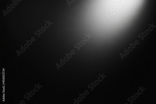 Bright light shining on textured black background for black friday sale