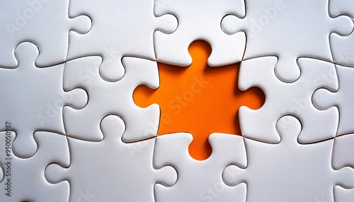 Picture of an orange puzzle piece that fits into a white puzzle. Teamwork, solutions, and problem-solving concepts are emphasized.